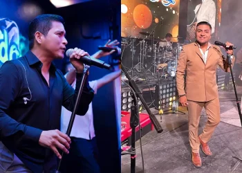 Dos cantantes de cumbia peruana se presentan en el escenario durante un concierto en vivo, micrófono en mano y con la banda tocando al fondo